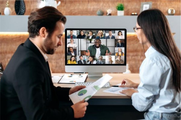 two people in front of a computer on a virtual meeting